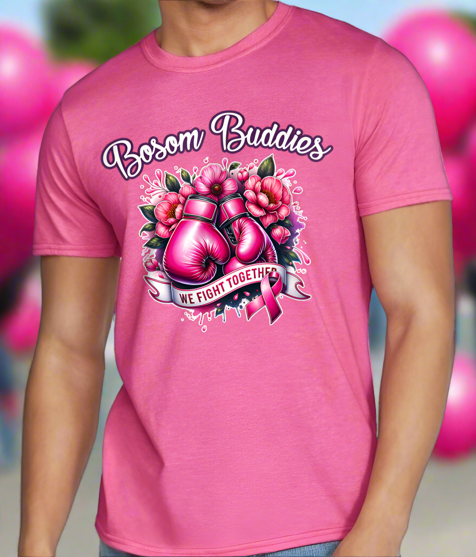 Person wearing a pink t-shirt with 'Bosom Buddies' design featuring boxing gloves and flowers.